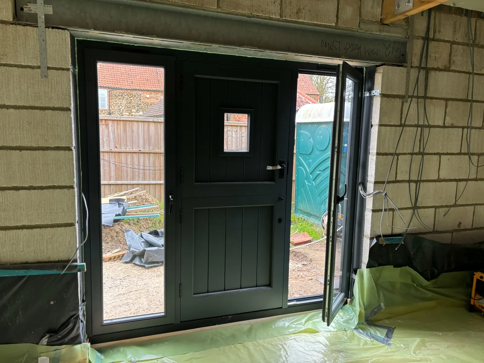 Windows and glazed doors along a Norfolk barn conversion